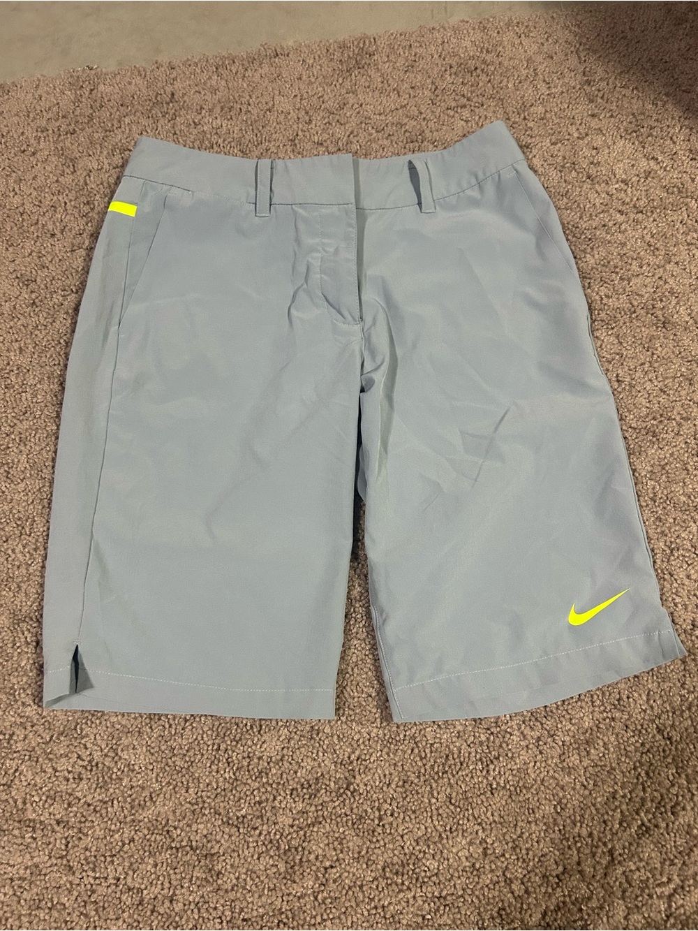 Nike Women’s Light Gray Athletic Shorts with Neon Yellow Swoosh size 4
